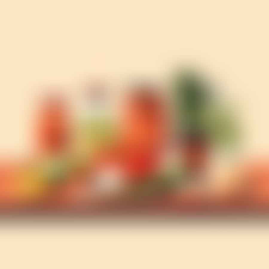 Assortment of fresh vegetables, spices, and jars on a kitchen counter