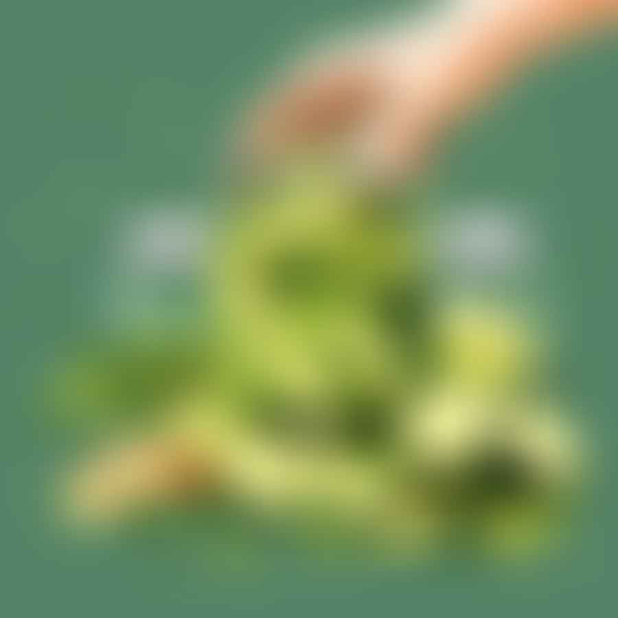 Hands packing sliced cucumbers into a glass jar